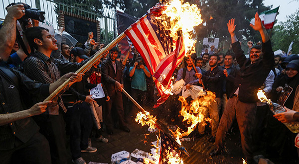 Iranians burning American flag